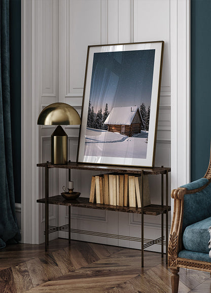 a room with a chair and a picture on a table