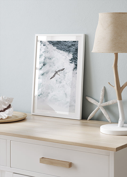 Grey Seagull Flying Over Waves Poster